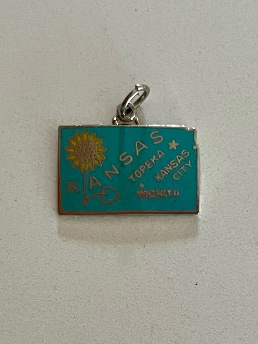 Vintage Kansas state-shaped sunflower enamel charm